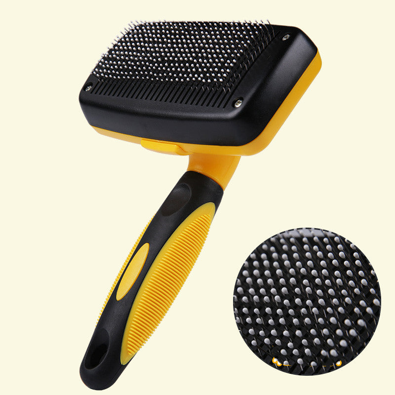 Close-up of the fine angled steel pins on the de-shedding brush head