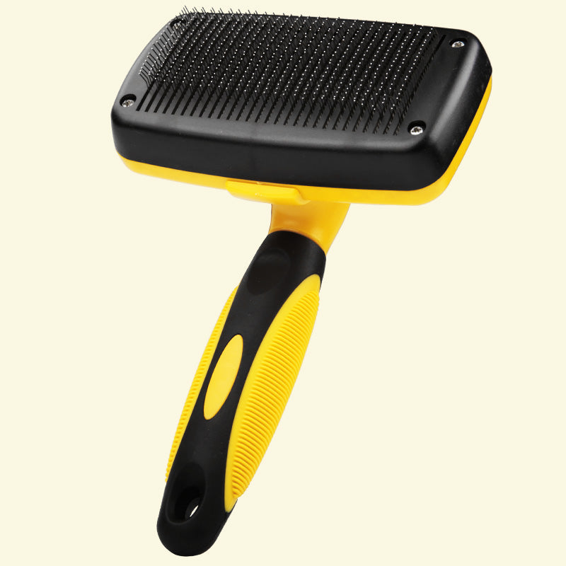 Yellow and black one-button self-cleaning slicker brush for dogs